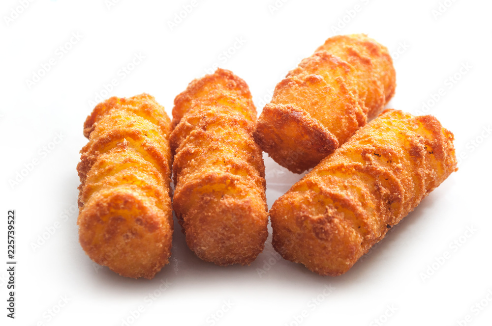 closeup of potato croquettes on white background