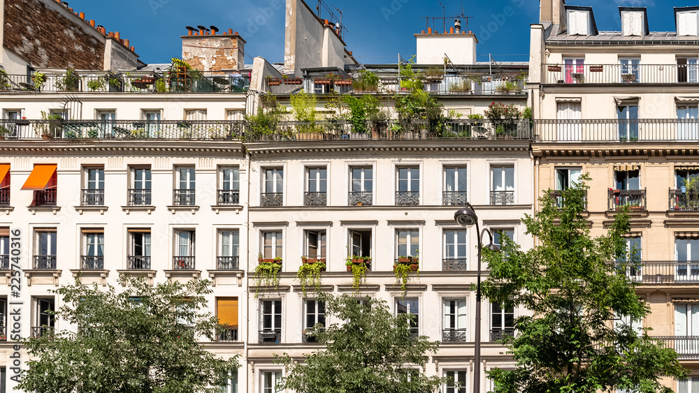 Paris, beautiful buildings, typical parisian facades in the Marais 
