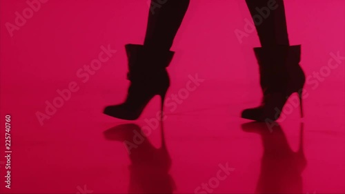 Loop of Close, woman in high heels walks with red abstract