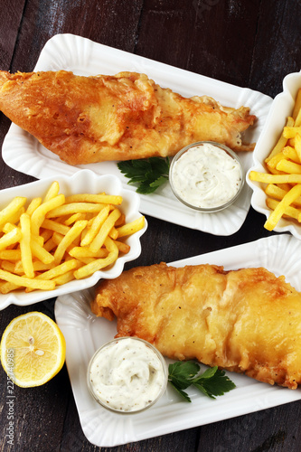 traditional British fish and chips consisting of fried fish, potato chips and mayonnaise photo