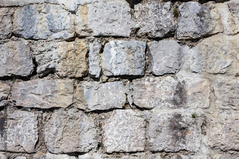 Fototapeta premium Background. Stacked Stone Wall, close up