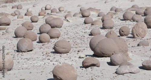 Detail of ball rocks, campo de bochas, over sand geological formation in Ischigualasto Provincial Park. Rioja Province, World Natural Heritage. Argentina