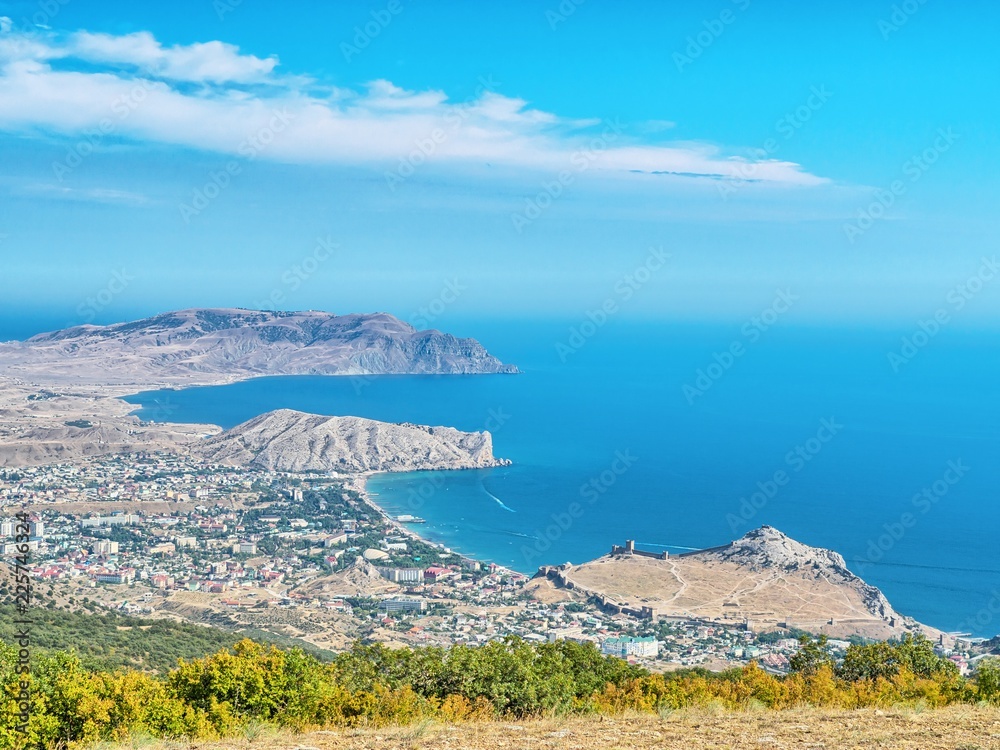 Summer view of Genoese fortress in Sudak city and Sudak bay