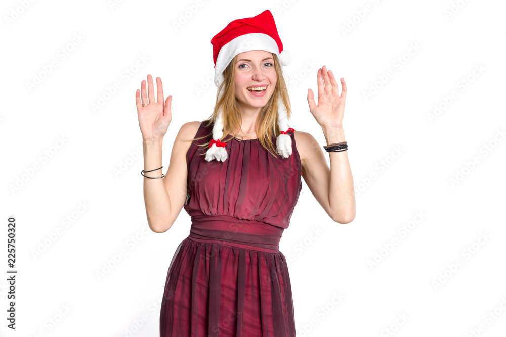 Happy young woman in Santa Claus hat showing two hands up, ten fingers or greeting sign. Christmas, New Year discounts, sale. Happy young woman in Santa Claus hat showing two hands up, ten fingers or greeting sign. Christmas, New Year discounts, sale.