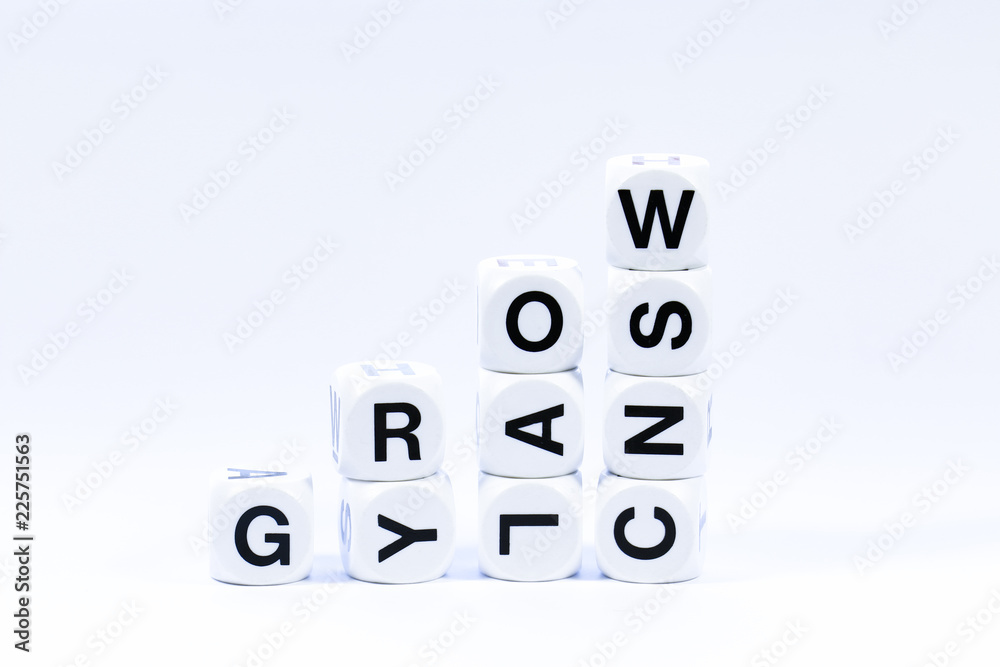 Lettered dice spelling out the word grow on a white background Lettered dice spelling out the word grow on a white background