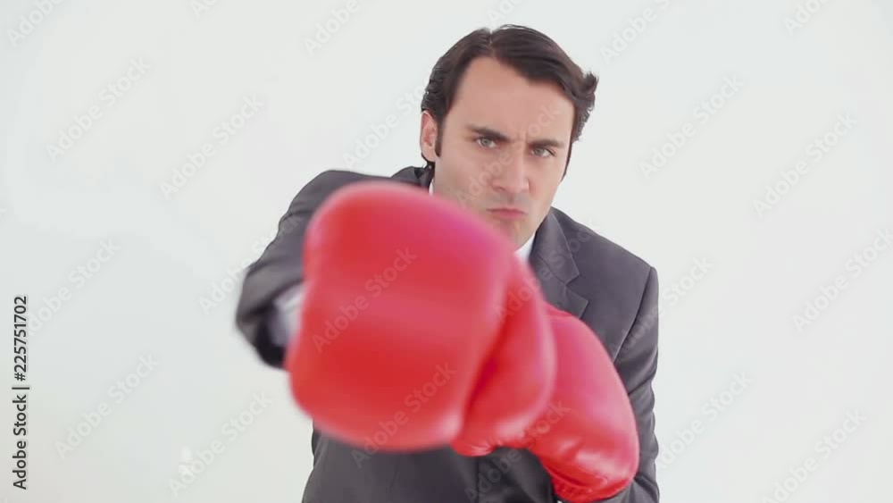 Loop of Serious man using boxing gloves Loop of Serious man using boxing gloves