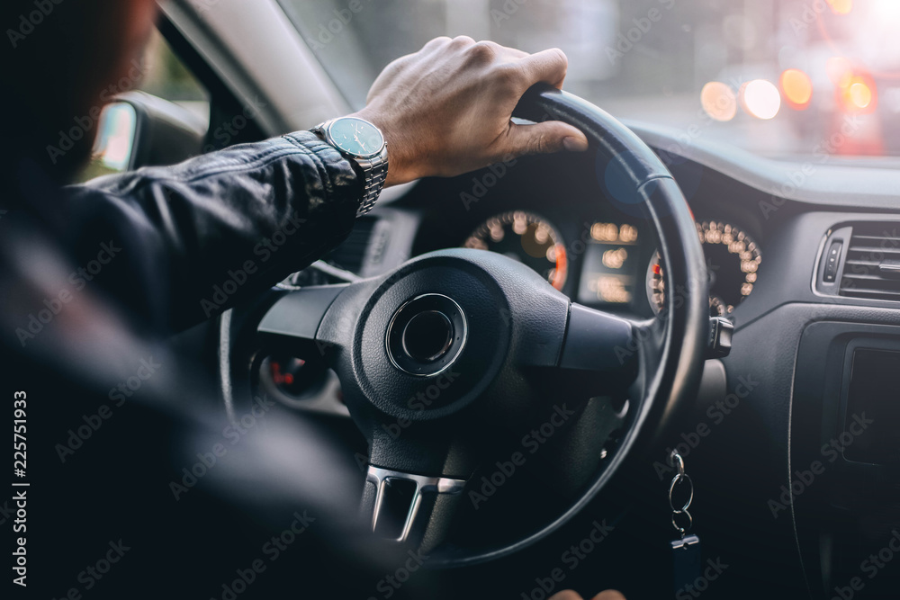 driver of a modern car in the evening. a trip city. driver of a modern car in the evening. a trip city.