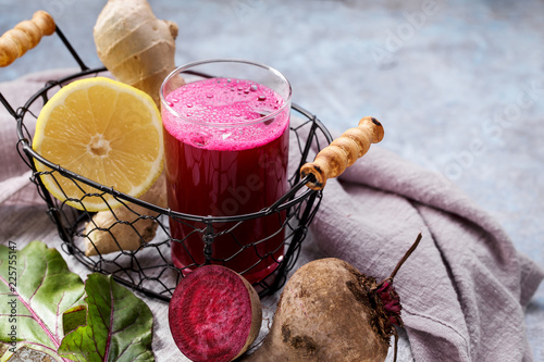 Beetroot juice with ginger and lemon. Colon cleansing smoothie photo