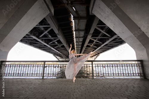 Elegant ballet dancer young girl dancing ballet outdoor photo