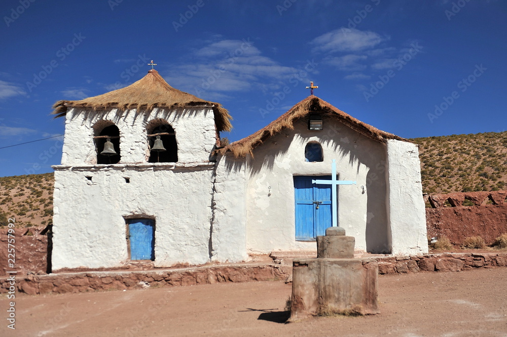 A small church with a thatched roof in the highlands of the Atacama Desert.