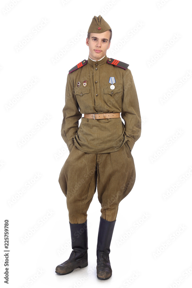 A soldier in military uniform of soviet army stay with both hands in  pockets Photos | Adobe Stock