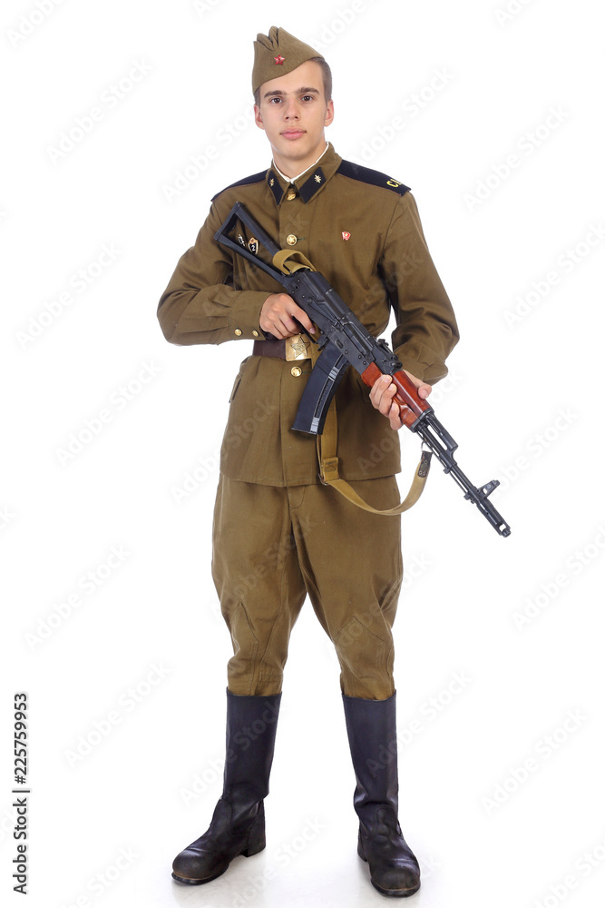 A soldier in military uniform of soviet army stay and hold Kalashnikov  rifle Stock Photo | Adobe Stock