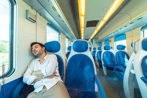 tired man sleeping in the train