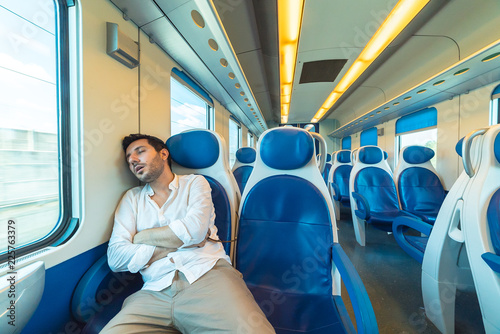 tired elegant man sleeping on the train