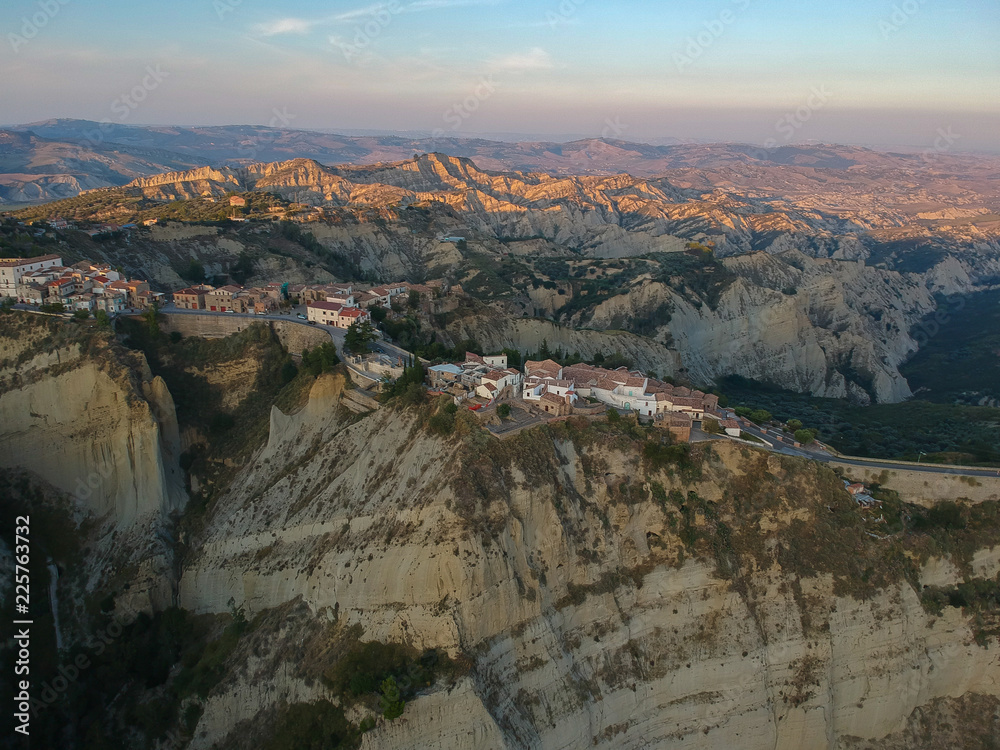 view of Aliano, a town in the province of Matera, in the Southern Italian region of Basilicata, Italy. Famous for the typical calanchi landscape. Aerial view