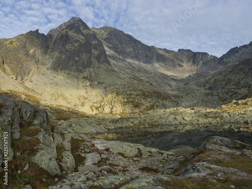 view on mountain lake Prostredne Spisske pleso at the end of the hiking route to the Teryho Chata mountain shelter in the High Tatras in Slovakia photo