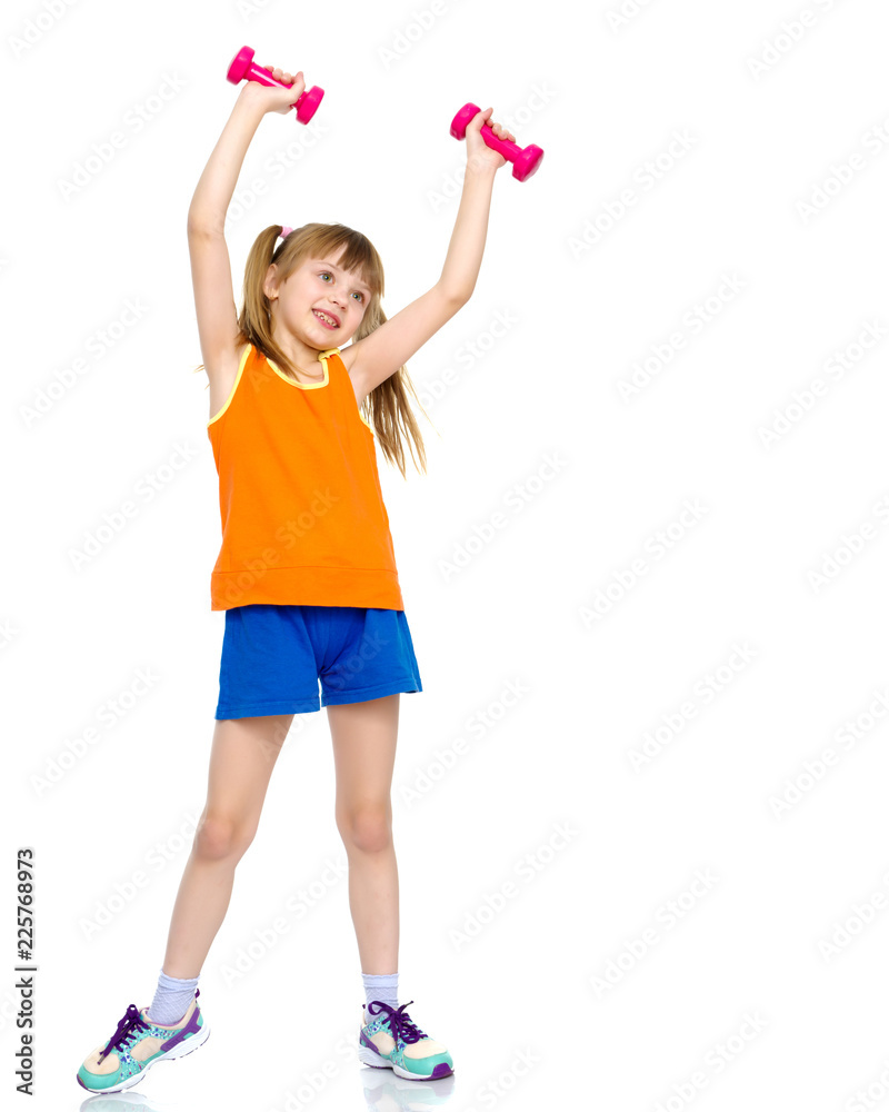 Little girl doing exercises with dumbbells. Little girl doing exercises with dumbbells.
