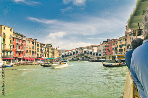 First person view from vaparetto public transport of the Grand Canal and Rialto Bridge in Venice, Italy