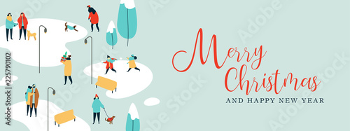 People and dogs at winter park on Christmas