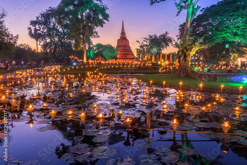 Sukhothai Co Lamplighter Loy Kratong Festival at The Sukhothai Historical Park covers the ruins of Sukhothai, in what is now Northern Thailand. photo