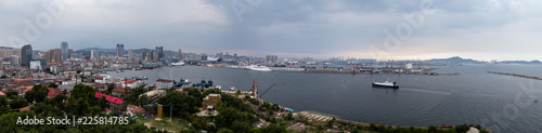 Panoramic view of the commercial port of Yantai, China, from Yantai Shan, a hill in the old town with a lighthouse, a temple and the smoke signal terrace that gives the name to the city photo