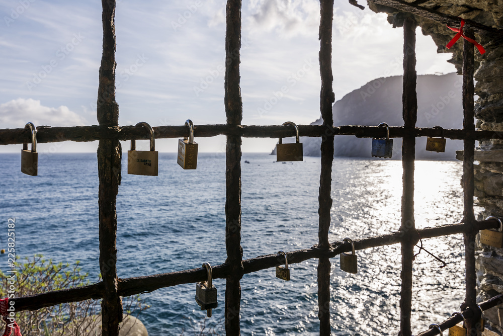 Padlocks hanging from a window on the sea, with promises of eternal love, Monterosso al mare, La Spezia, Liguria, Italy Padlocks hanging from a window on the sea, with promises of eternal love, Monterosso al mare, La Spezia, Liguria, Italy