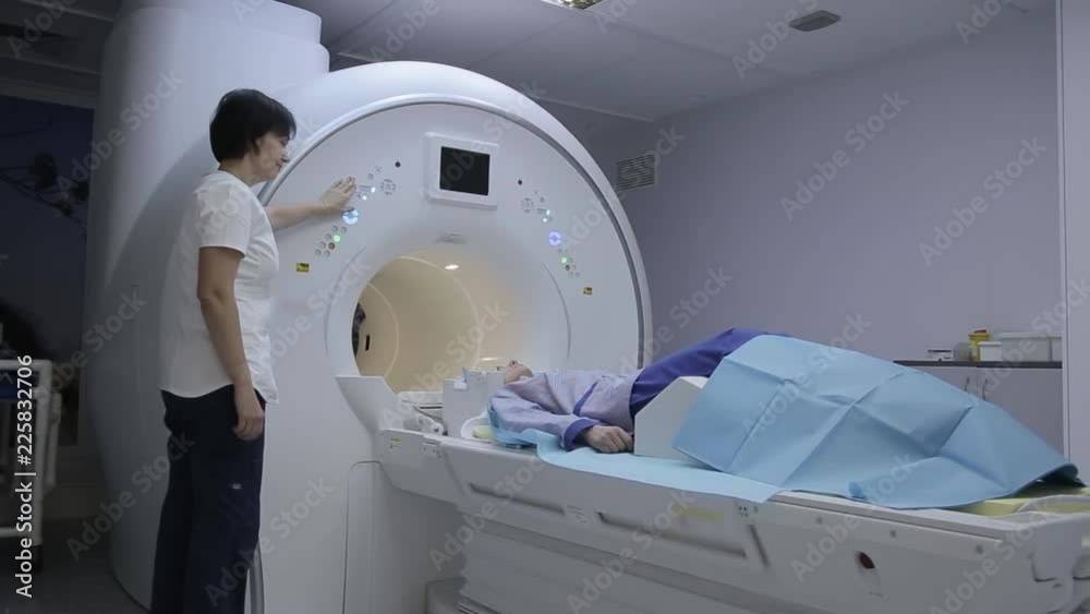 The doctor conducts a medical examination of the patient using magnetic ...