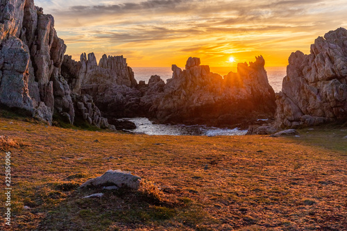 Sunset over a sharp rocky coastline