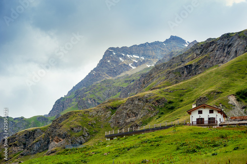 Alpine landscape with htipical house in Aosta Valley, Italy photo