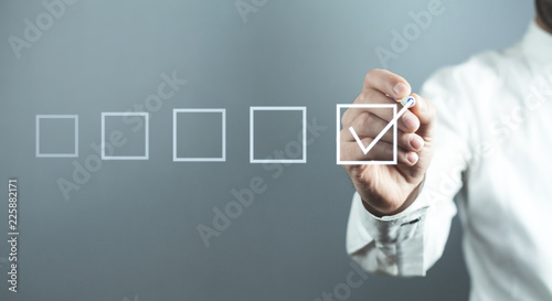 Man with checkbox. Business concept photo