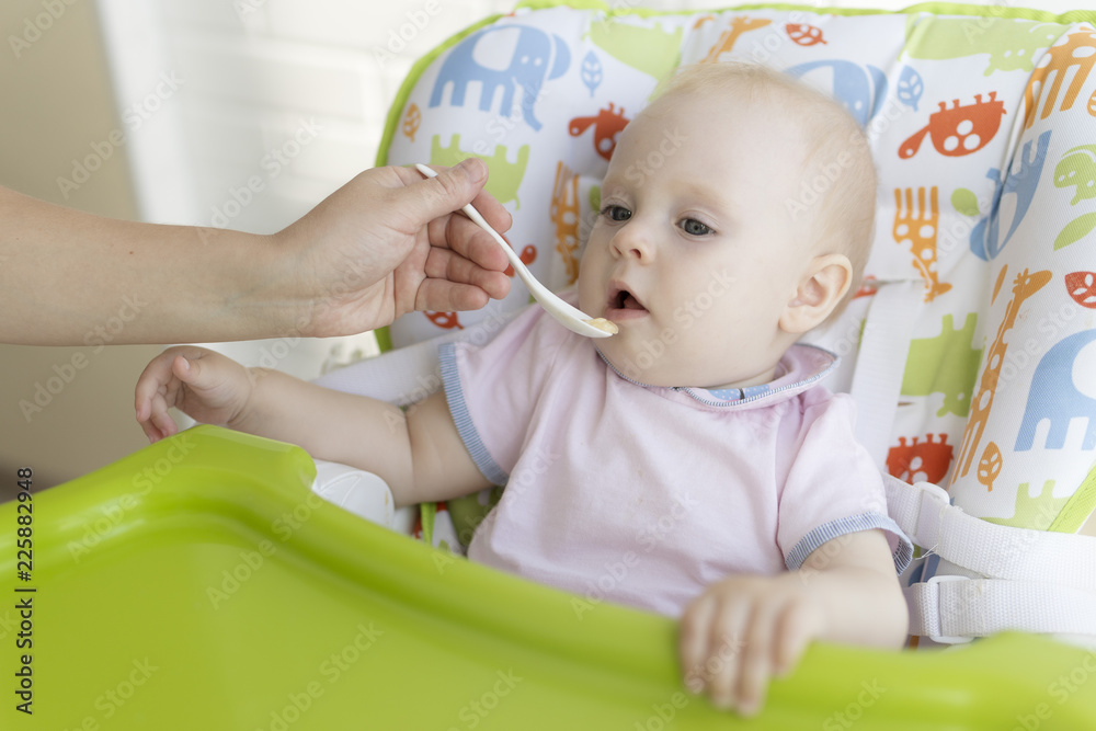 Portrait of cute baby boy while mother feeding Portrait of cute baby boy while mother feeding