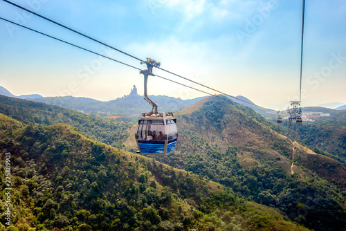 Photography gong Ping cable car with Tian Tan big buddha statue in Lantau Island, Hong Kong China