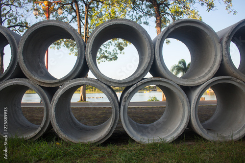 Concrete drainage pipes stacked on construction site, Can use background
