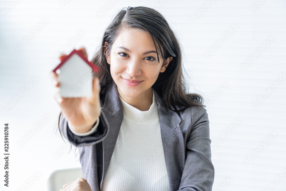architecture, building, construction, real estate and property concept - close up of hands holding house model.Home loan property ownership assurance concept architecture, building, construction, real estate and property concept - close up of hands holding house model.Home loan property ownership assurance concept