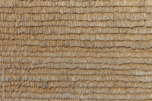 Canvastavla straw background for isolation of a wall at an old rural house