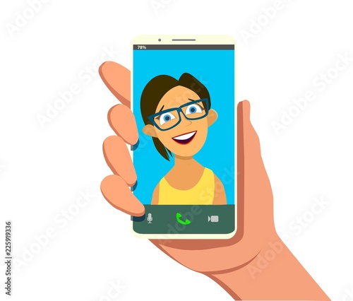 Young beautiful Smiling girl on display smartphone. Human hand holding mobile phone and looking at the screen. Chat, Video call, self portrait.
