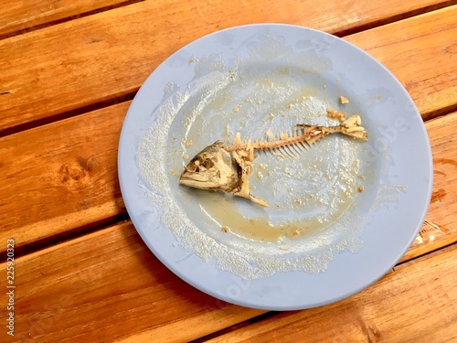 Fish bone (mackerel) on dirty dish