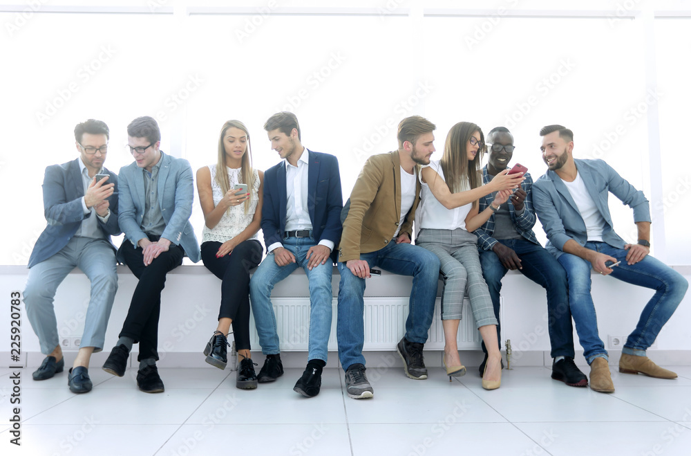 Fototapeta premium group of young people communicate in the waiting room.