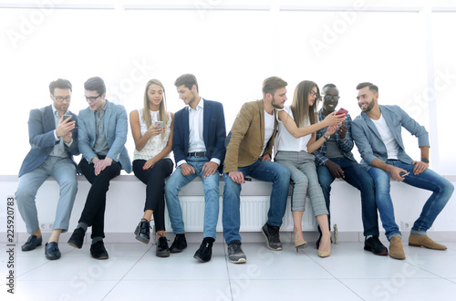 group of young people communicate in the waiting room.