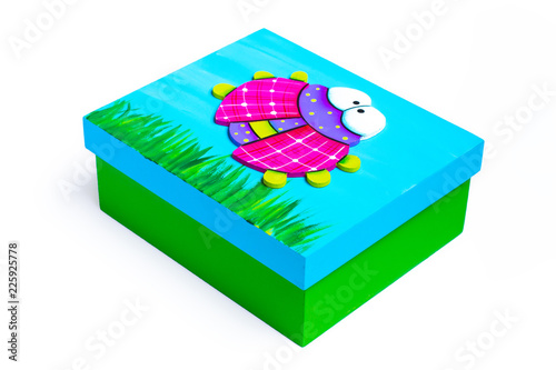 Colorful isolated box with a ladybug painted on the top with white background