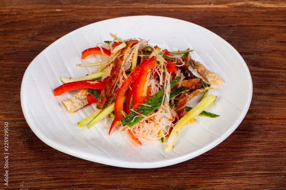 Salad sakekawa with salmon skin