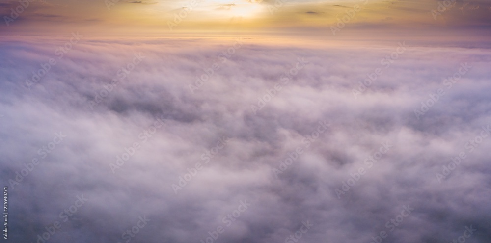 Beautiful foggy sunrise panoramic landscape from drone.