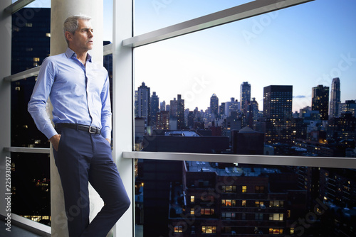 Businessman standing near window