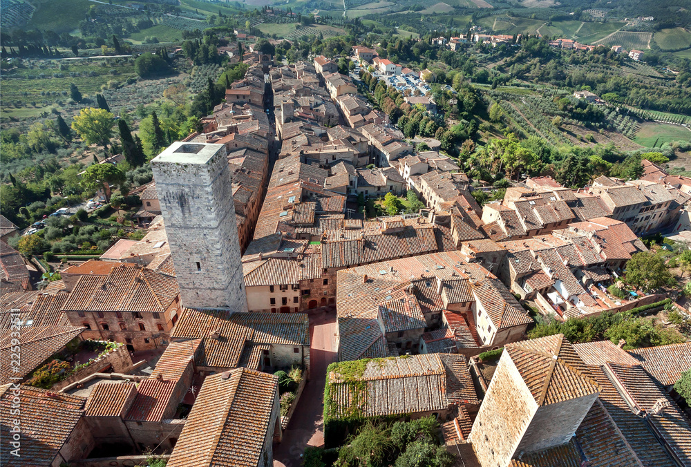 Historical landscape with brick towers and old houses of italian town San Gimignano. UNESCO World Heritage Site