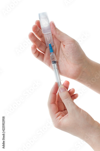 Syringe with ampoule in his hand girl