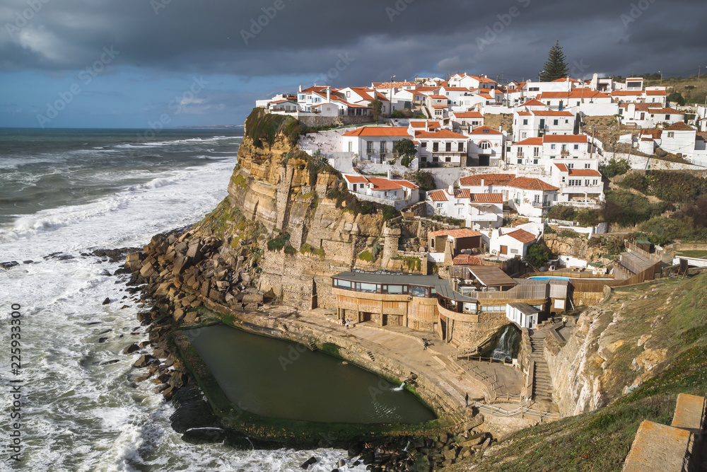 Azenhas do Mar, beautiful village in the municipality of Sintra, built on a cliff-top, overlooking the Atlantic Ocean, Portugal. Travel Europe.