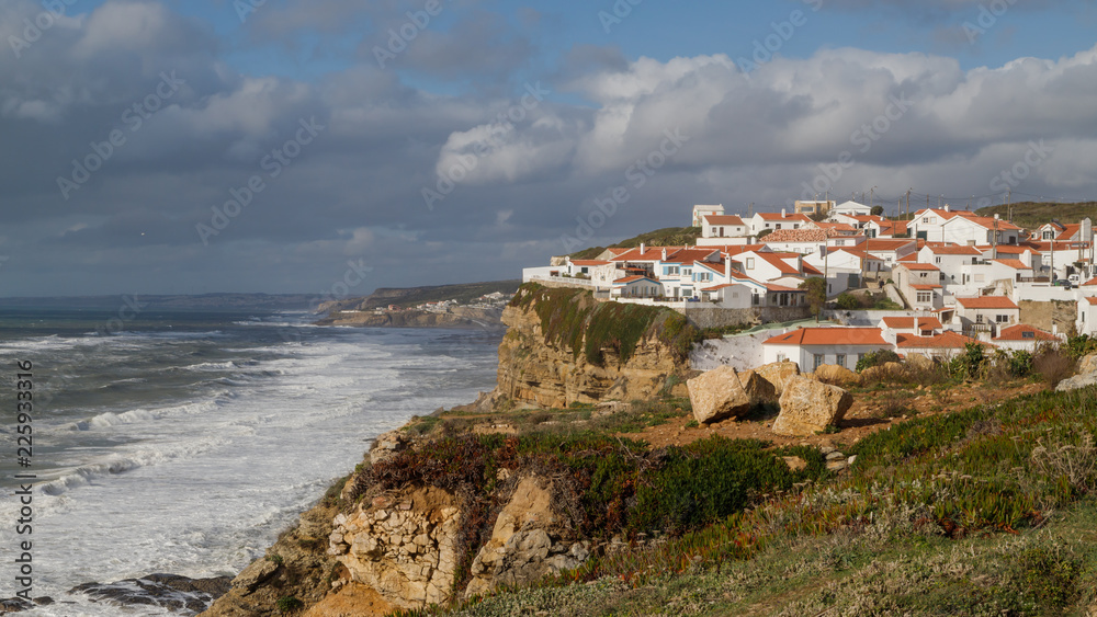 Azenhas do Mar, beautiful village in the municipality of Sintra, built on a cliff-top, overlooking the Atlantic Ocean, Portugal. Travel Europe.