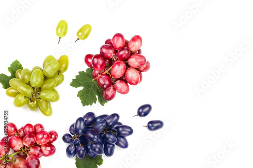 Fototapeta Naklejka Na Ścianę i Meble -  green pink and blue grapes with leaves isolated on the white background with copy space for your text. Top view. Flat lay pattern