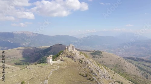AERIAL: drone flying over the mountains towards the castle of Rocca Calascio, Abruzzo, Italy, in a sunny day. photo