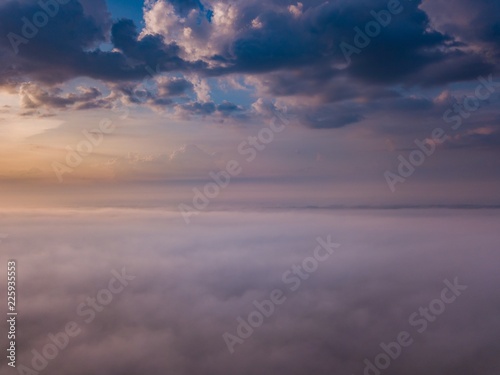 Beautiful foggy sunrise landscape from drone. © milosz_g